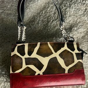 Niche giraffe print w faux red patent leather base.. chain handle